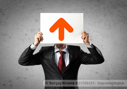 Businessman with an up-arrow signboard