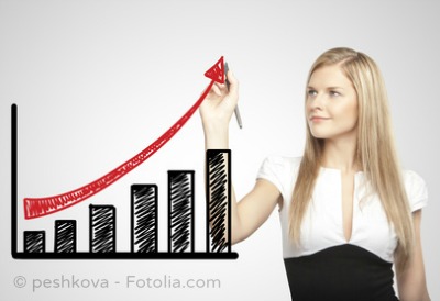 businesswoman drawing growth of chart