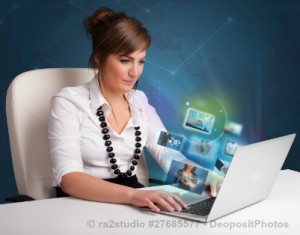 Girl researching pictures on laptop