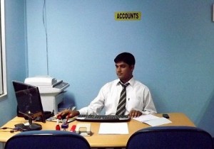 Working at his office desk